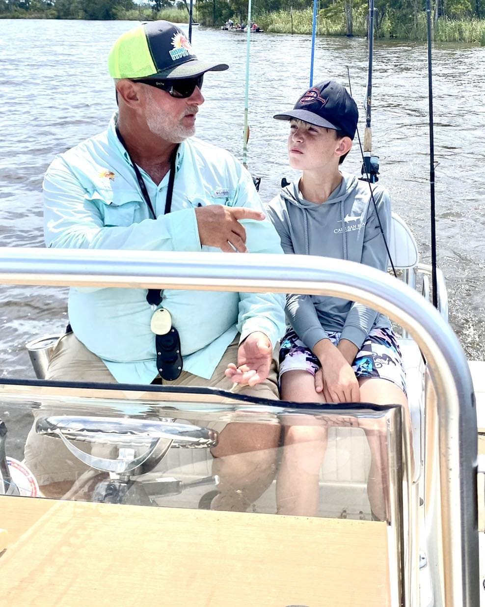 Father and son riding on a boat