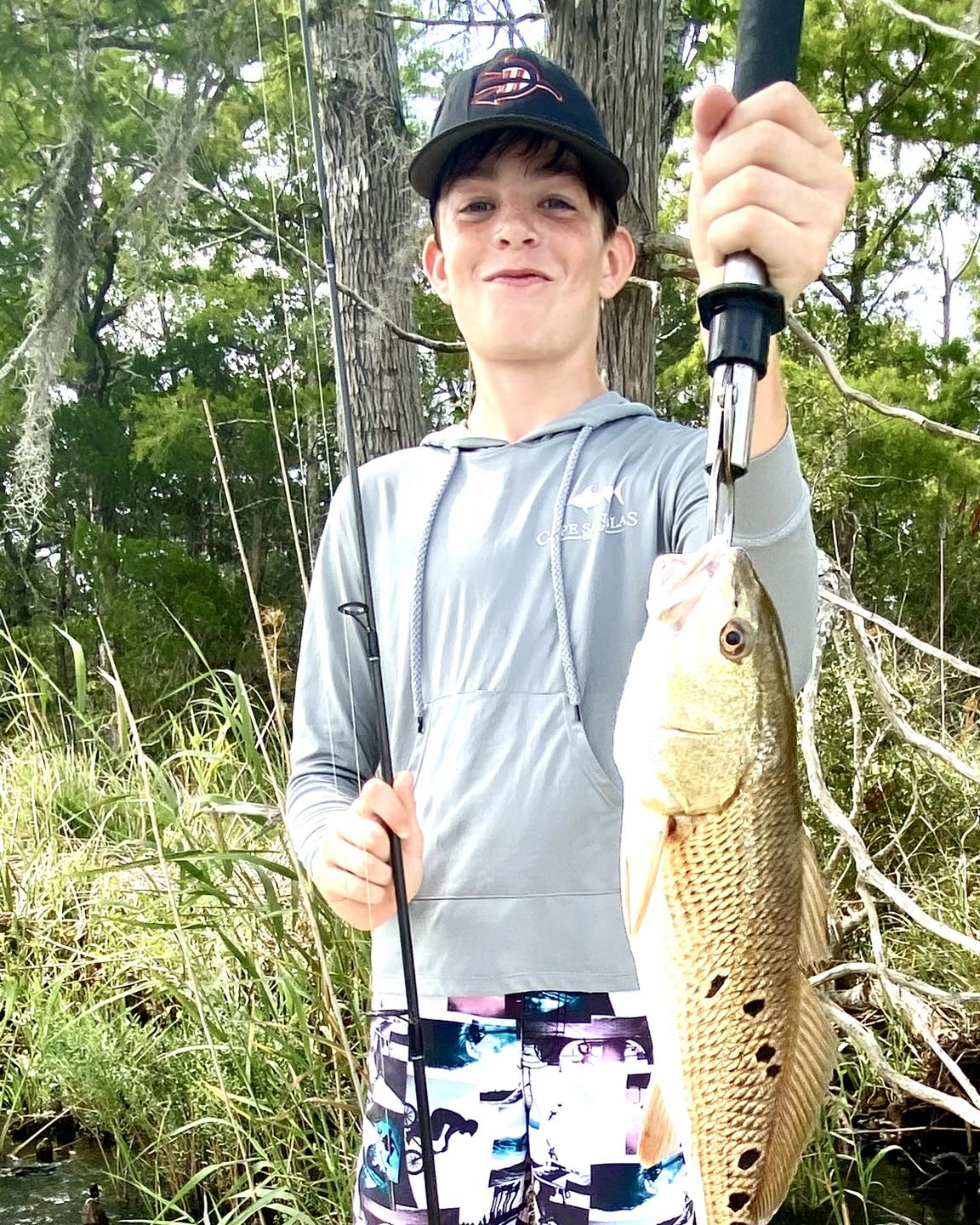Little boy caught a fish